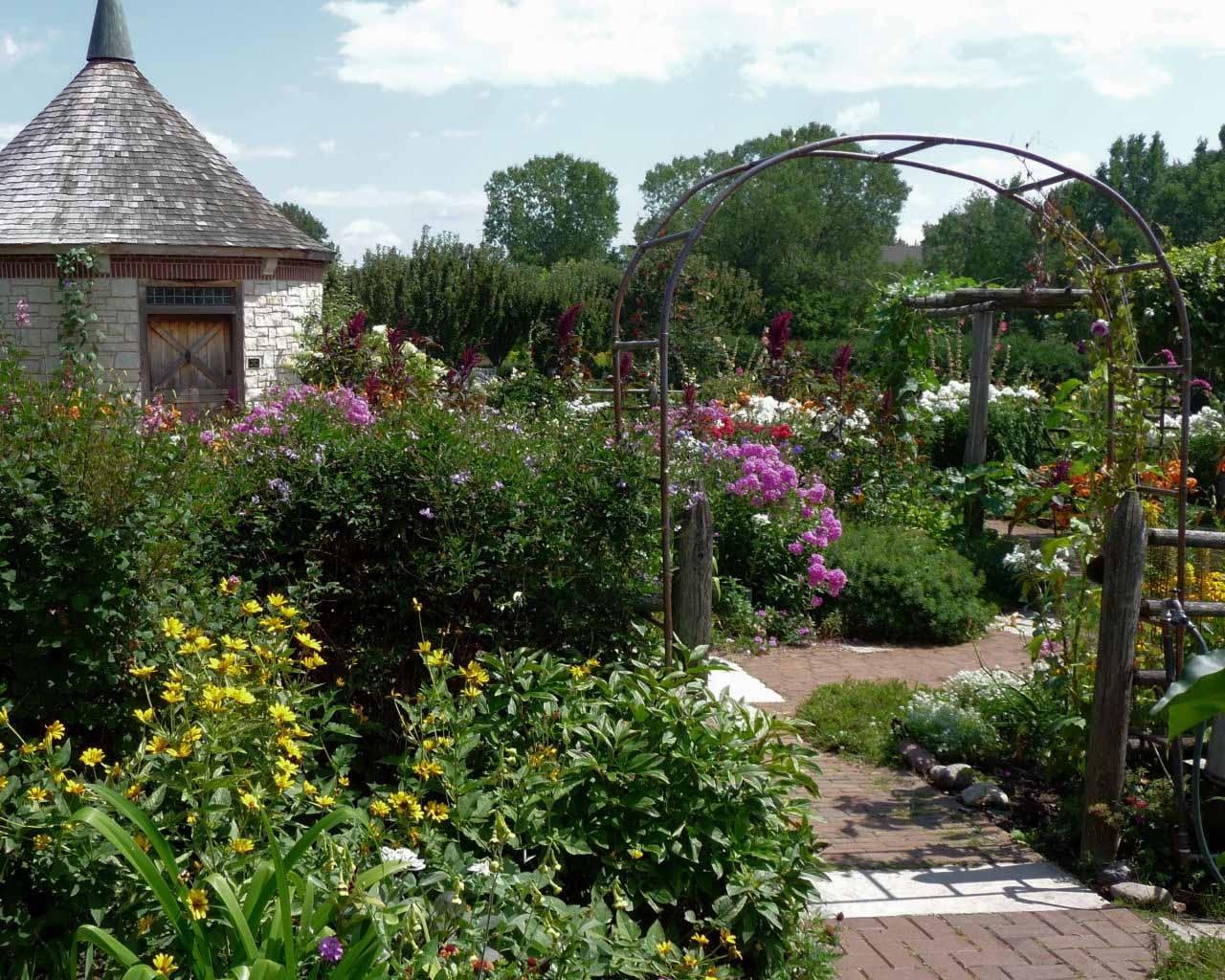 1280x1024 Flower Garden With Cottage Wallpaper