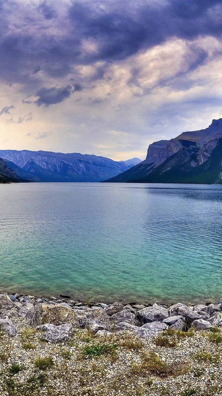 750x1334 Rocky Mountain, Lake, Stones, Sky, Clouds, Dusk 750x1334 IPhone 8 7 6 6S Wallpaper, Background, Picture, Image