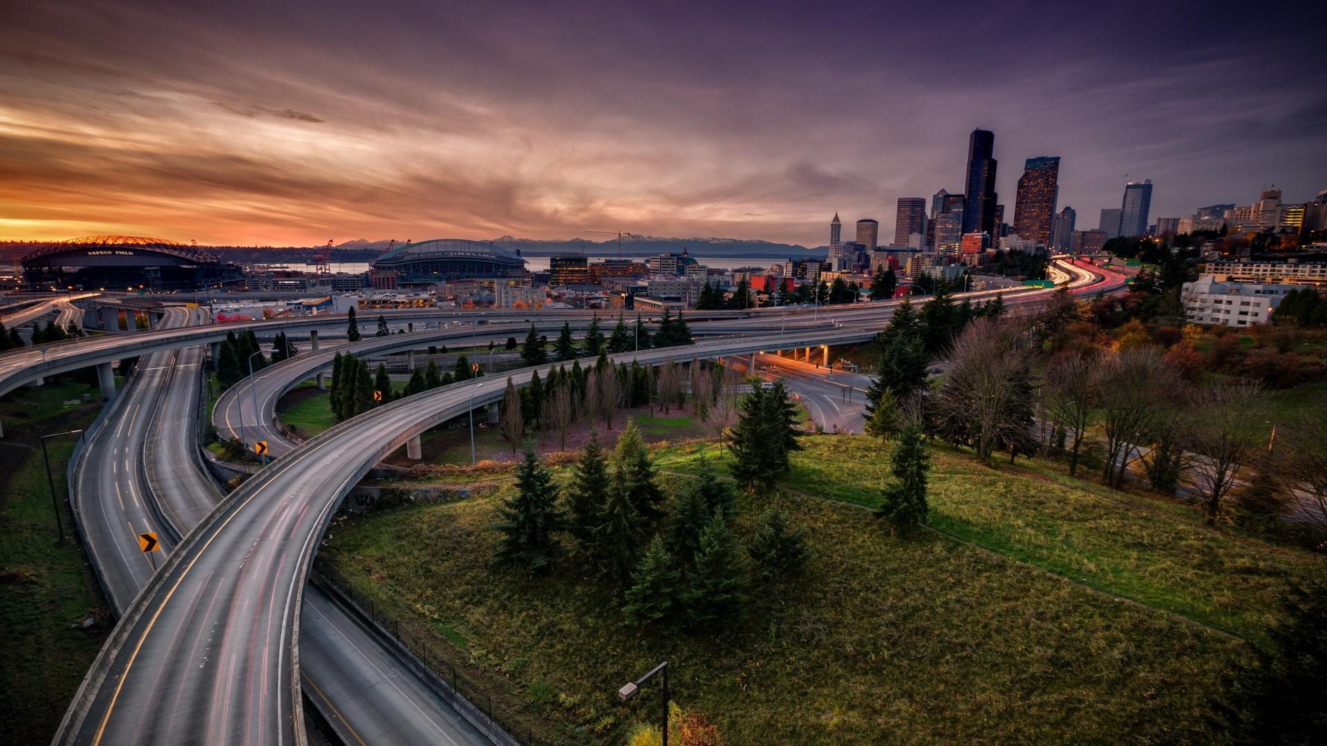 1920x1080 #road, #street, #highway, #skyscraper, #city, #building, #long exposure, #light trails, #architecture, #interchange, #grass, #sunset, #cranes (machine), #evening, #clouds, #USA, #trees, #stadium, #Seattle, #cityscape, wallpaper. Mocah HD