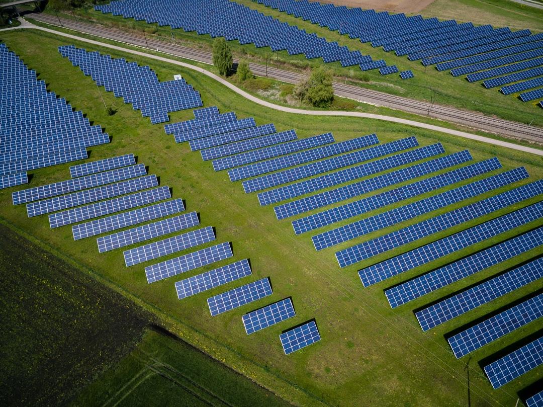 1080x809 aerial photography of grass field with blue solar panels photo