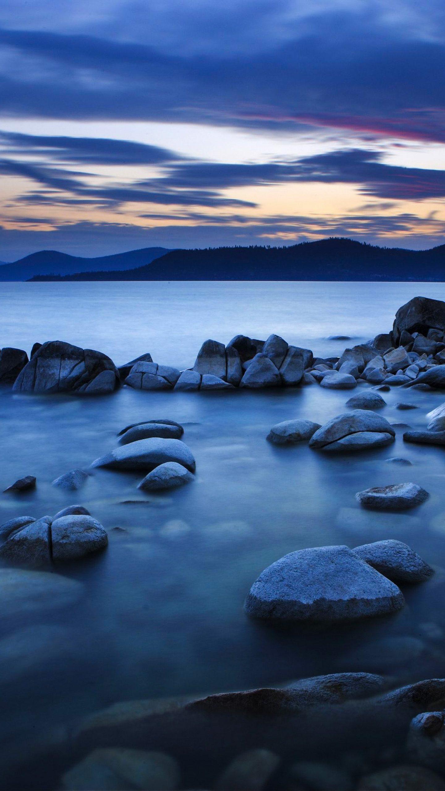 1440x2560 Rocks Lake Sea Blue Sky Clouds 4K Wallpaper