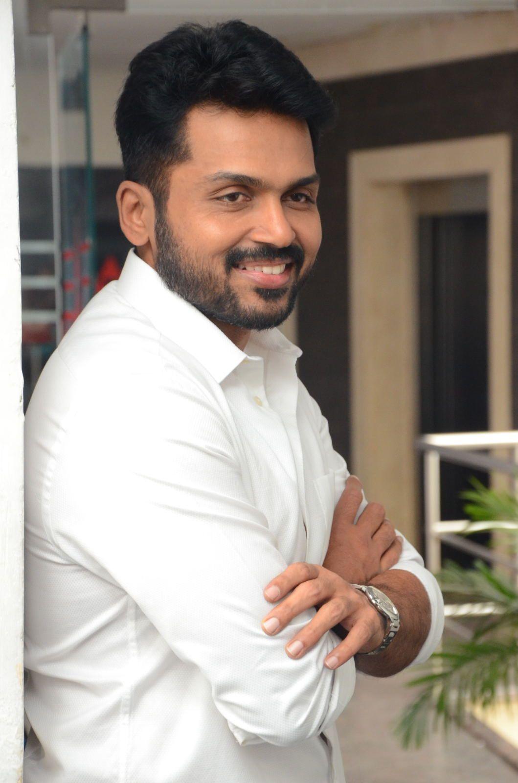 1059x1600 Tollywood Actor Karthi Beautiful Photo in White Shirt & Blue Jeans at Chinna Babu Movie Interview. Actor karthi, Cute boys image, Actors