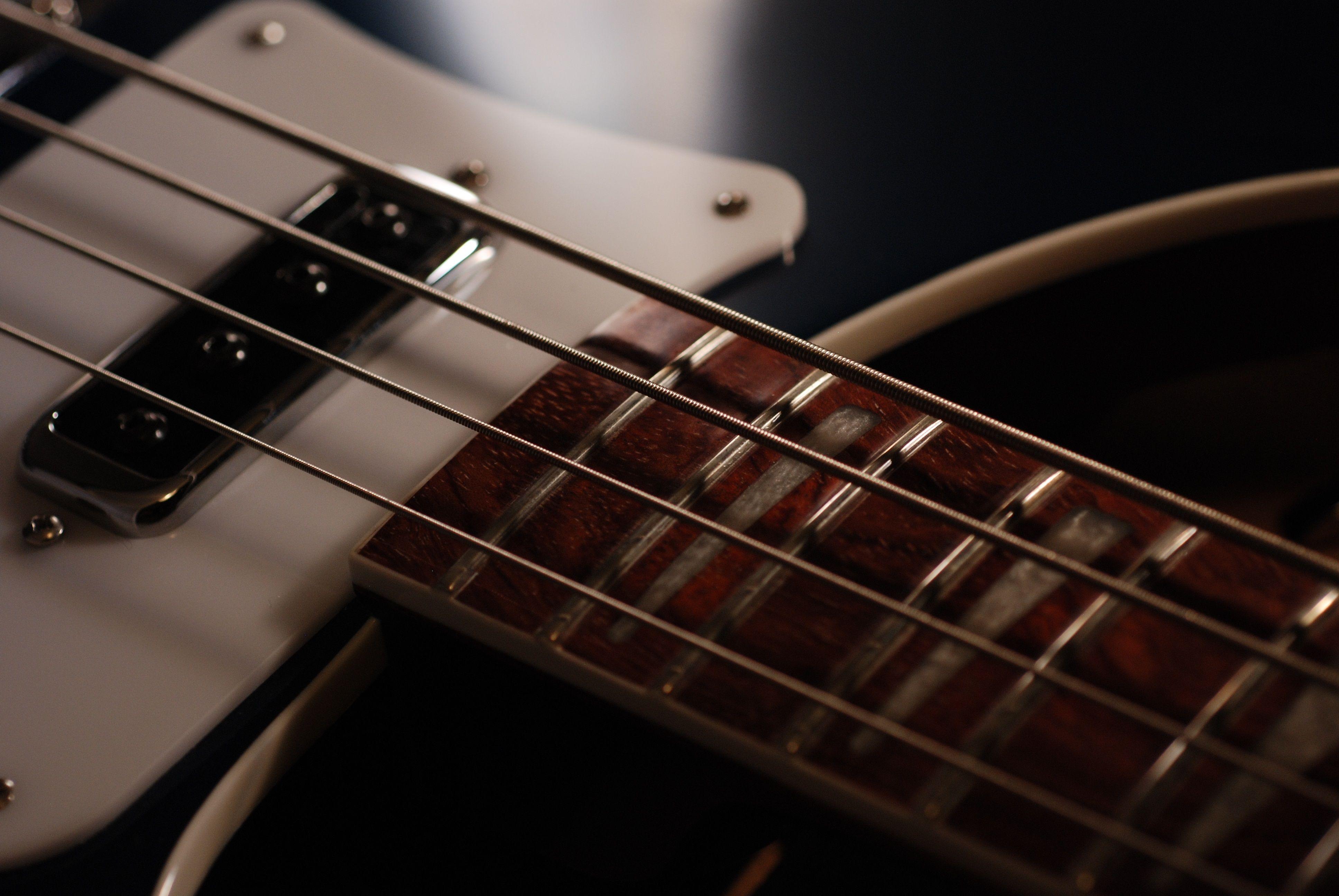 Premium AI Image | Bass guitar on a wooden background