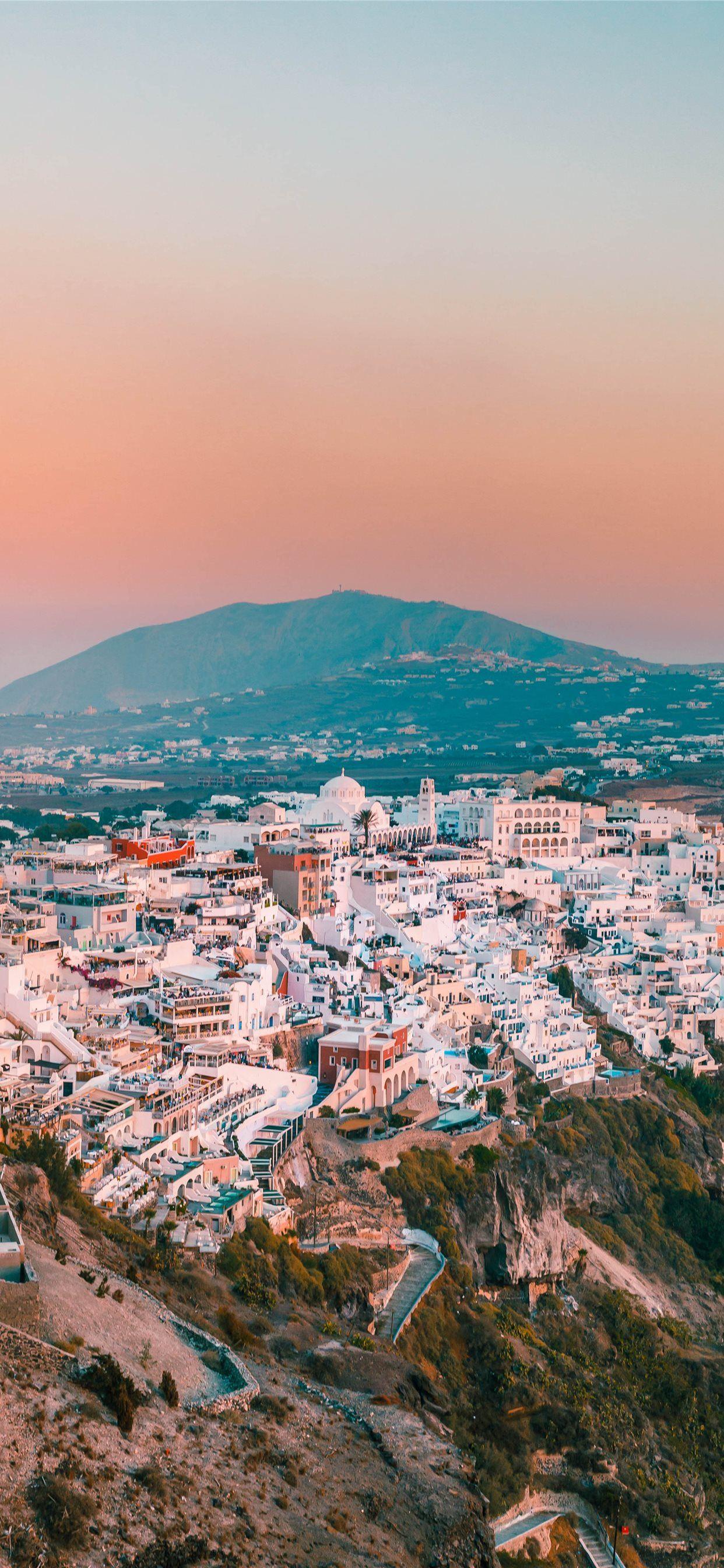 1242x2688 city buildings on mountain during daytime iPhone X Wallpaper Free Download