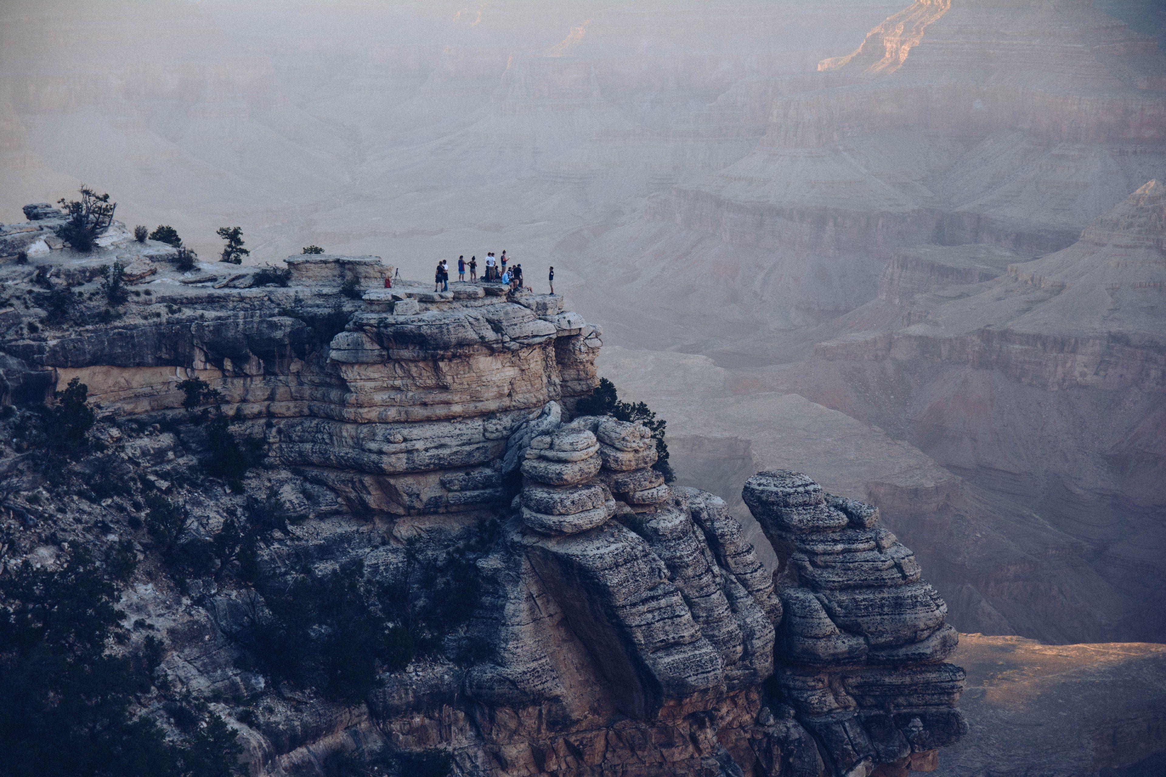 3840x2560 a group of people on a cliff looking across the grand canyoncliff