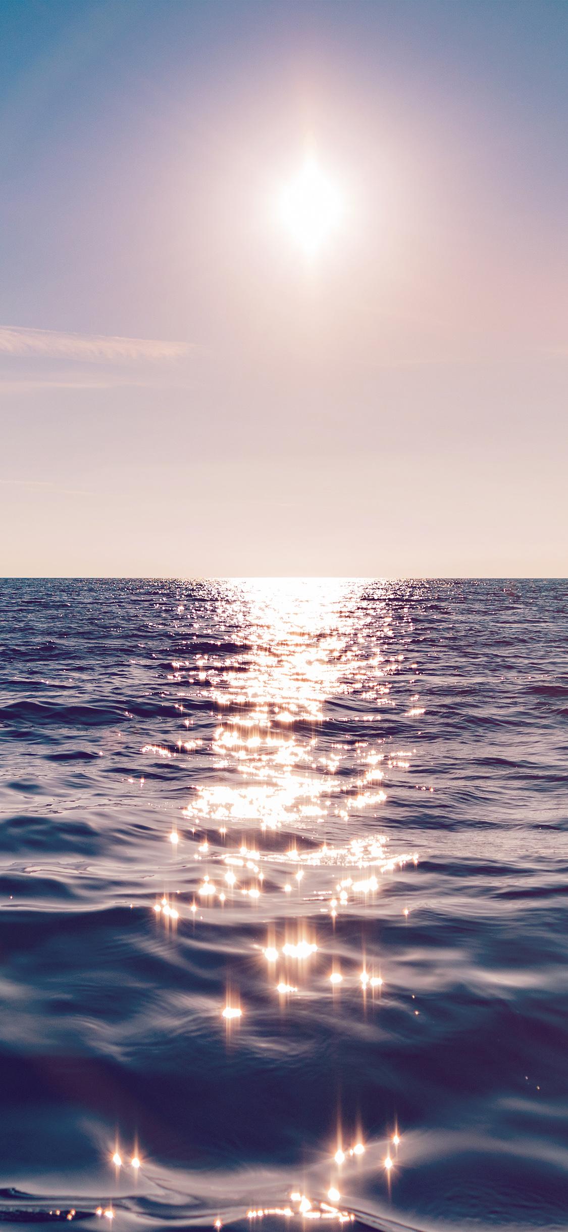 1125x2436 Sea Blue Wave Sunshine Ocean Flare Wallpaper