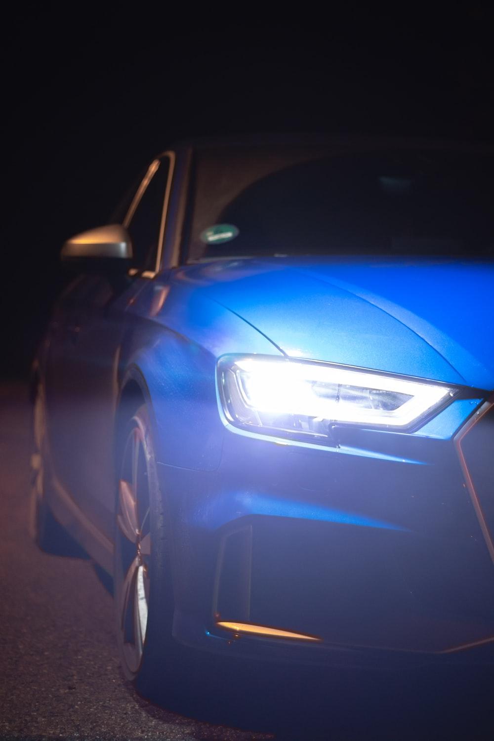 1000x1500 blue car on black asphalt road during night time photo