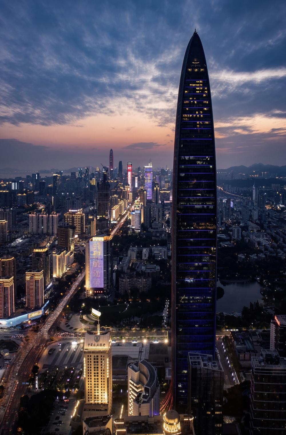 1000x1520 high rise buildings during night time photo