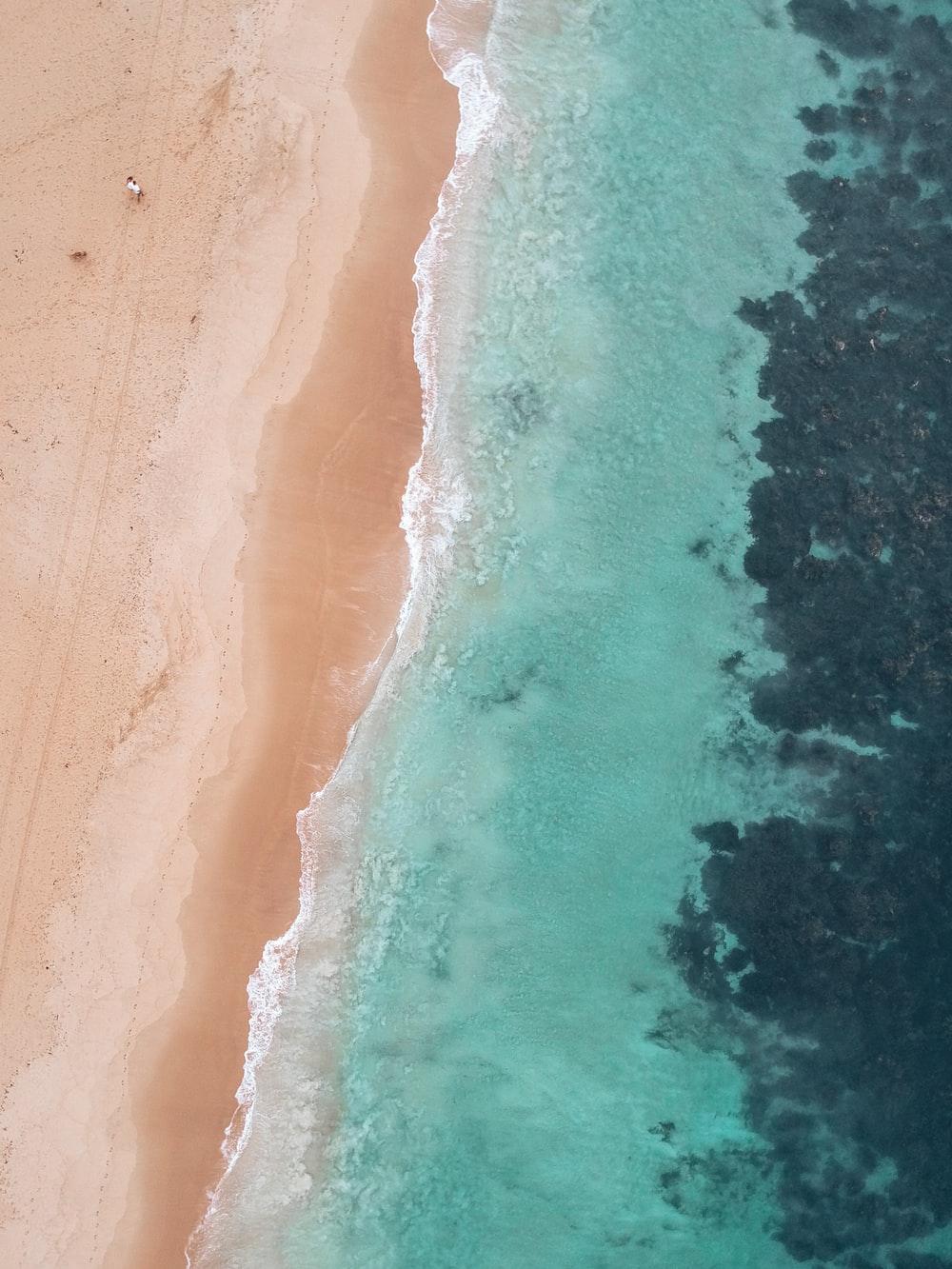 1000x1333 aerial view of beach during daytime photo