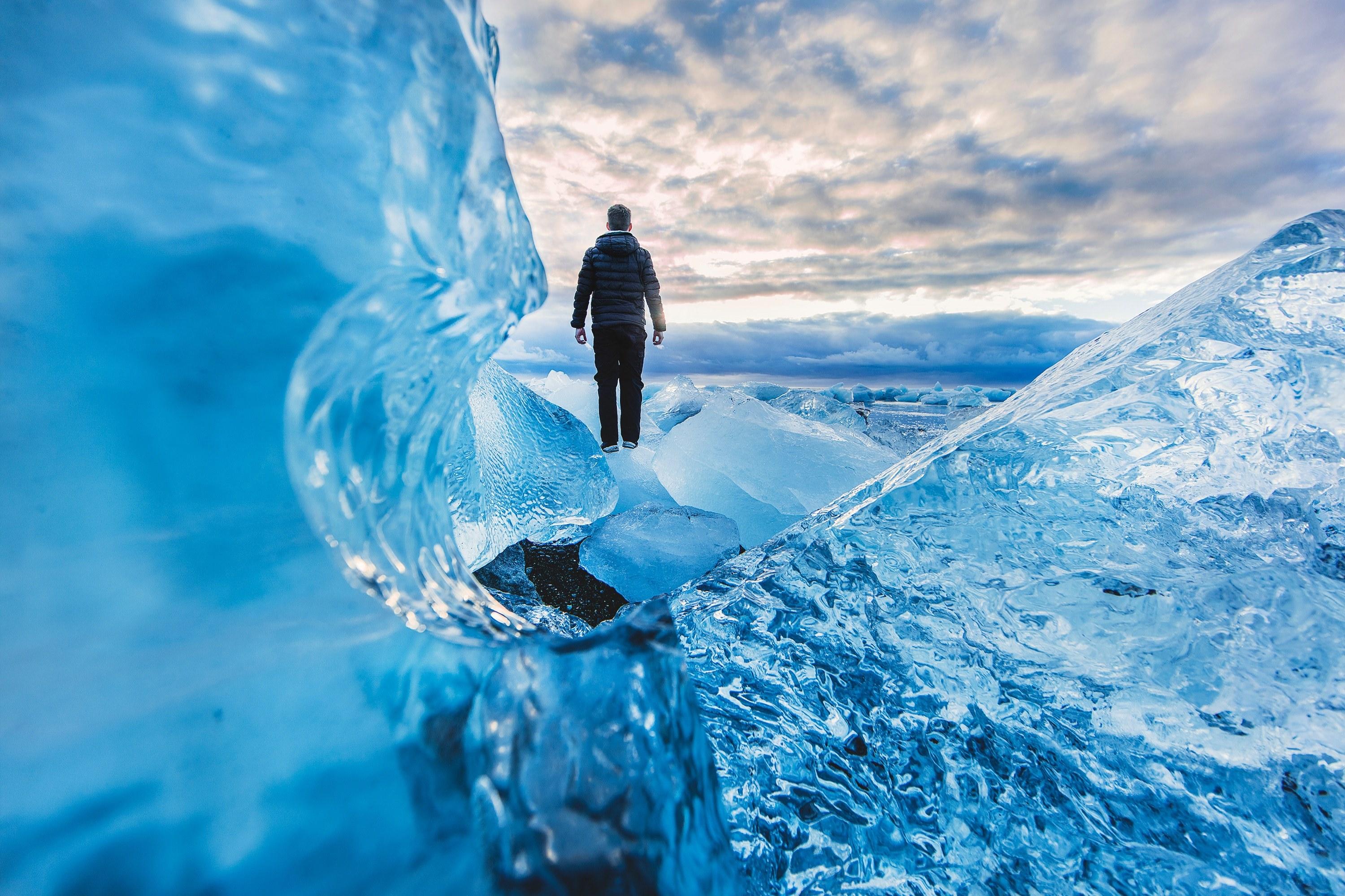 3000x2000 Wallpaper / a person standing on frozen water in jkulsrln, ice land 4k wallpaper