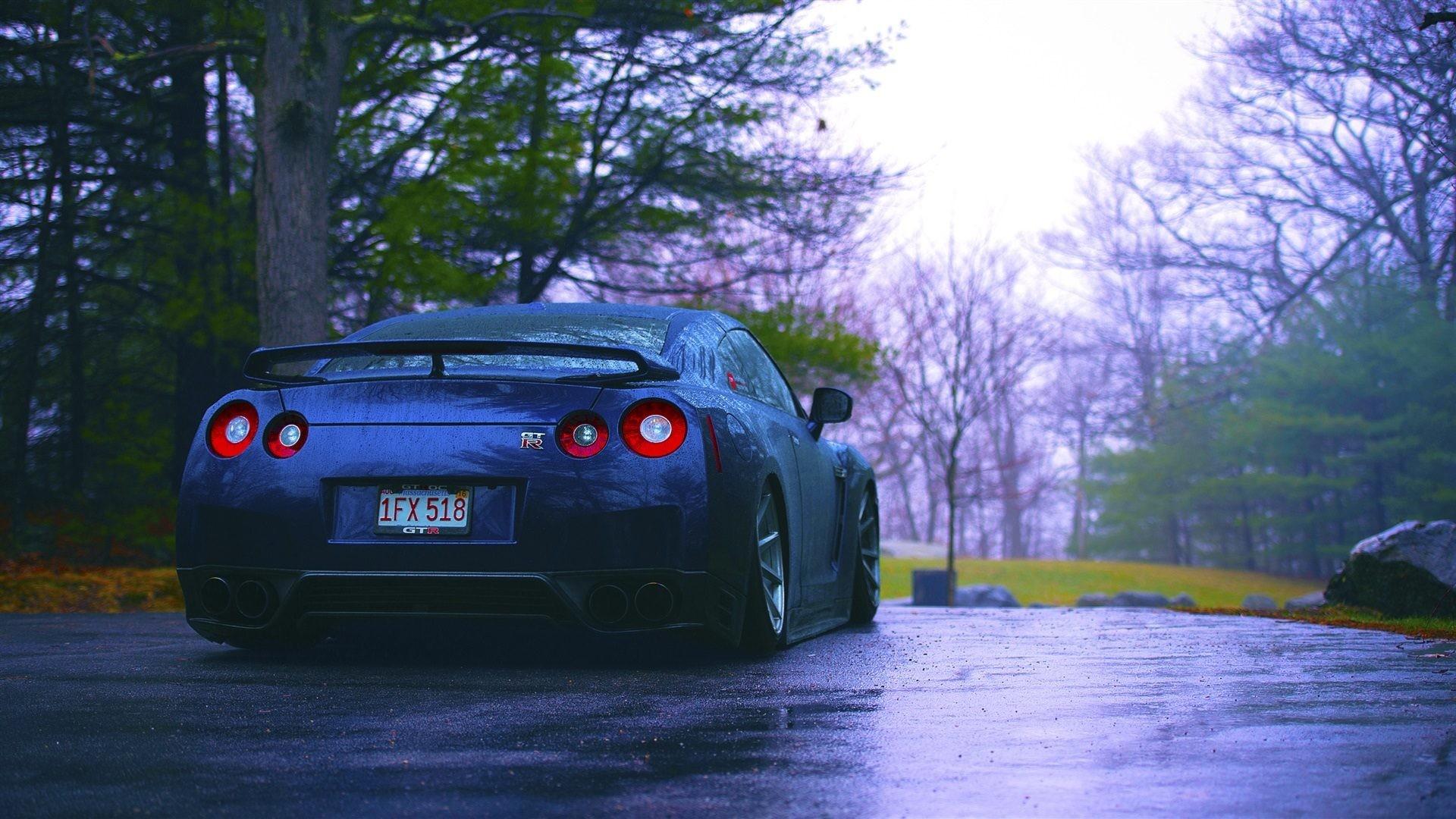 1920x1080 Nissan R35 GTR blue car rear view rain trees 4k Wide Screen Wallpaper
