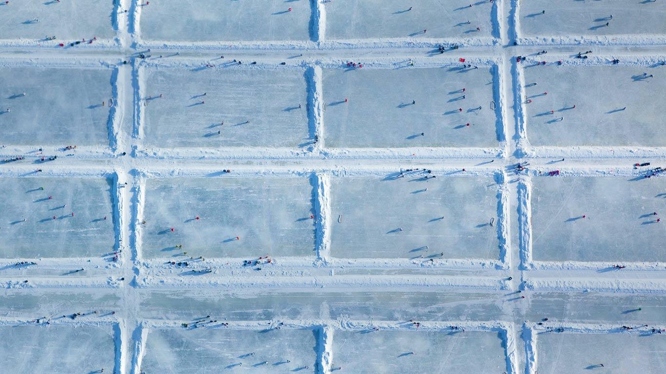 1366x768 USA Hockey Pond Hockey National Championships at Dollar Lake in Eagle River, Wisconsin wallpaper