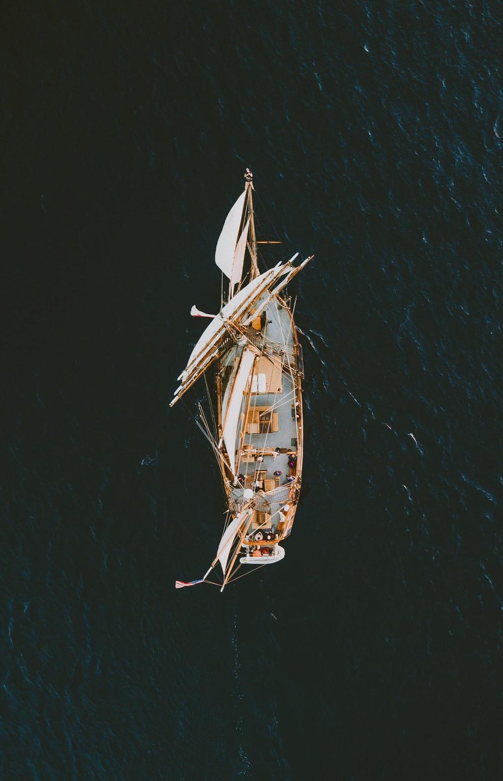 1000x1551 aerial photography of brown galleon ship on body of water photo