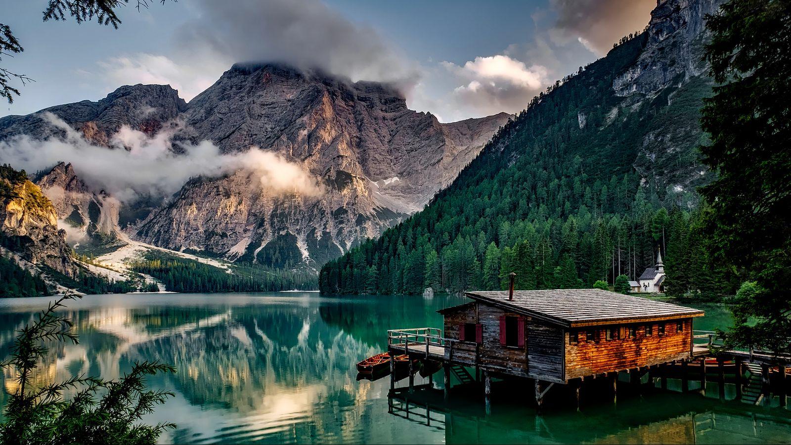 1600x900 Download wallpaper 1600x900 italy, mountain, lake, building, mountain landscape widescreen 16:9 HD background