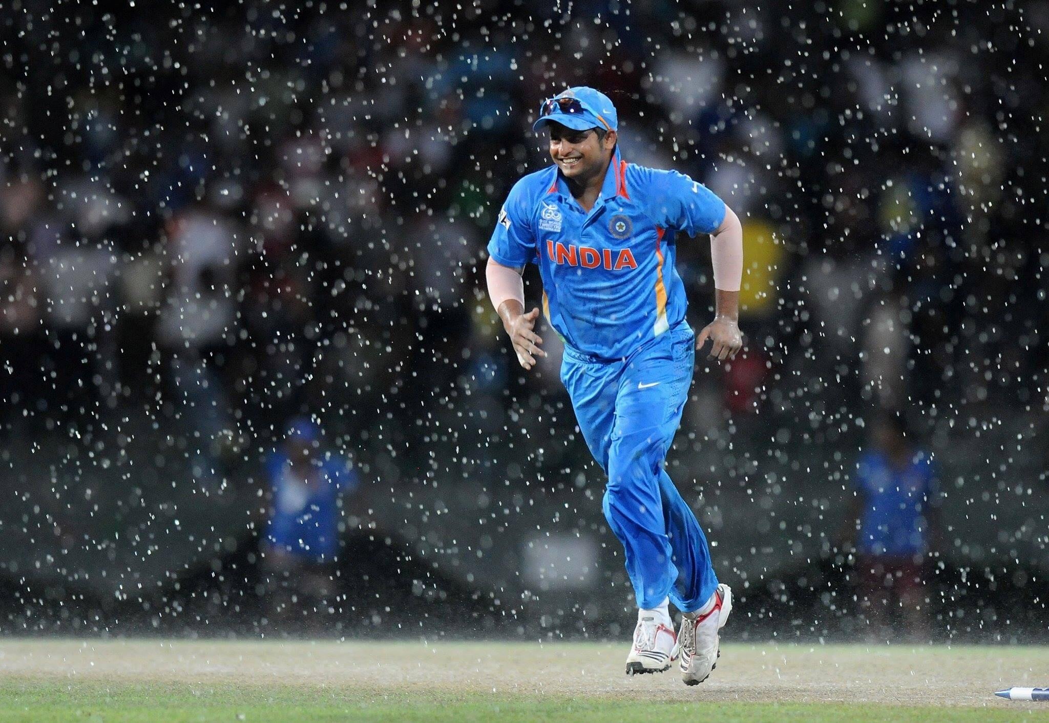 2048x1412 Suresh Raina Indian Batsman Criketer in Ground During Rain Wallpaper