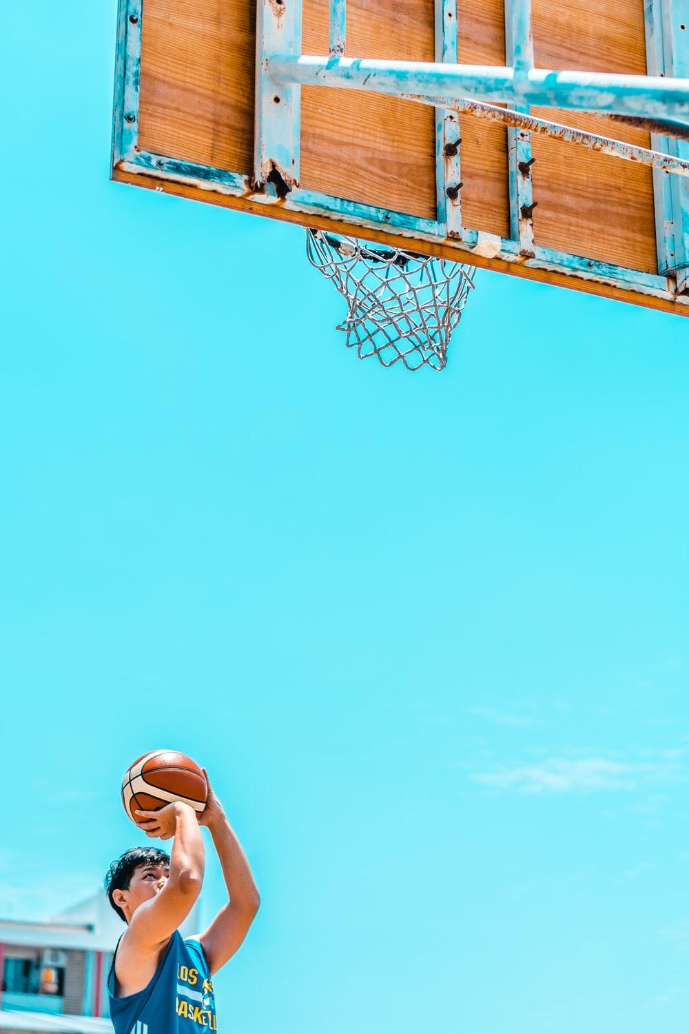 1000x1500 white and red basketball hoop on gray asphalt road during daytime photo
