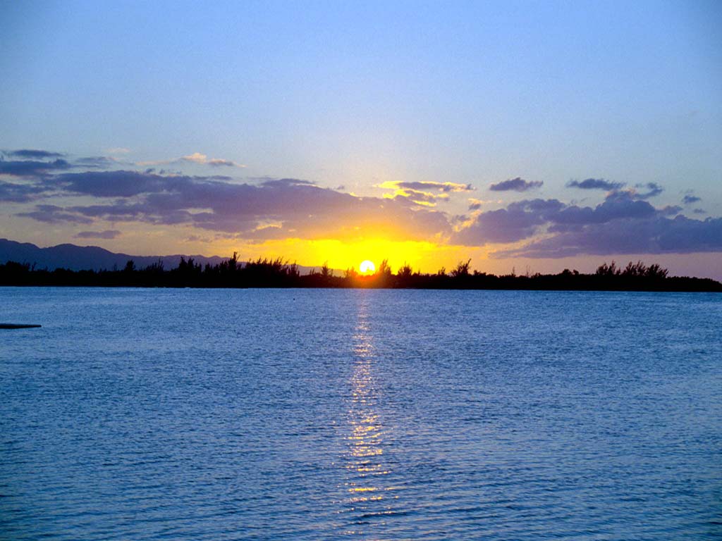 1024x768 On Vacation With A Jamaica Sunset Background For PowerPoint PPT Templates
