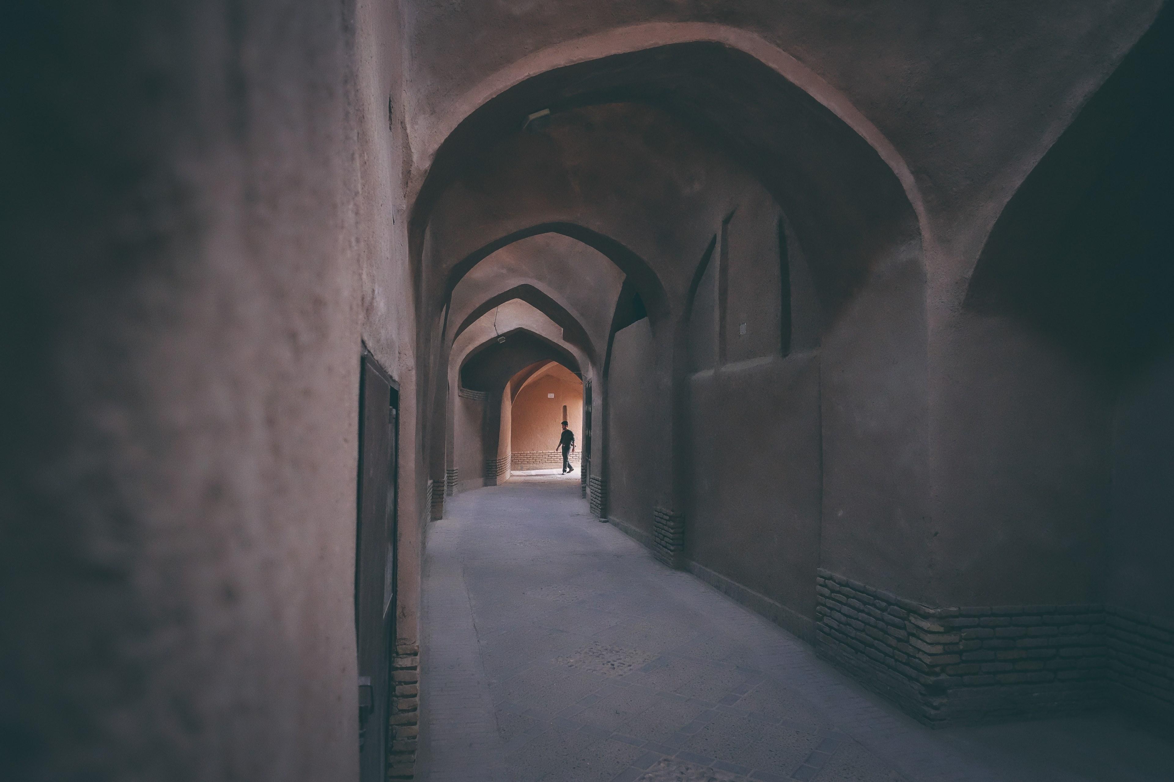 3840x2560 Wallpaper / a person walks through an empty arched passageway in an old town, friendship alleys in yazd iran_ 4k wallpaper