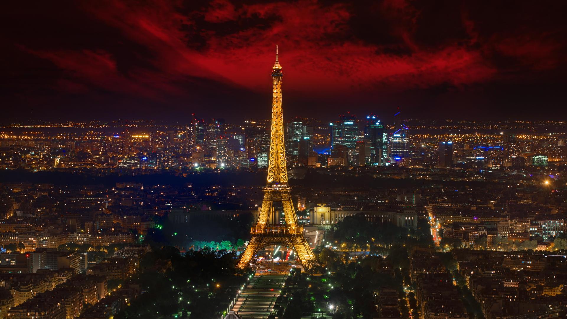 1920x1080 Eiffel Tower With Yellow Lighting And Paris City With Red And Black Sky Background HD Travel Wallpaper