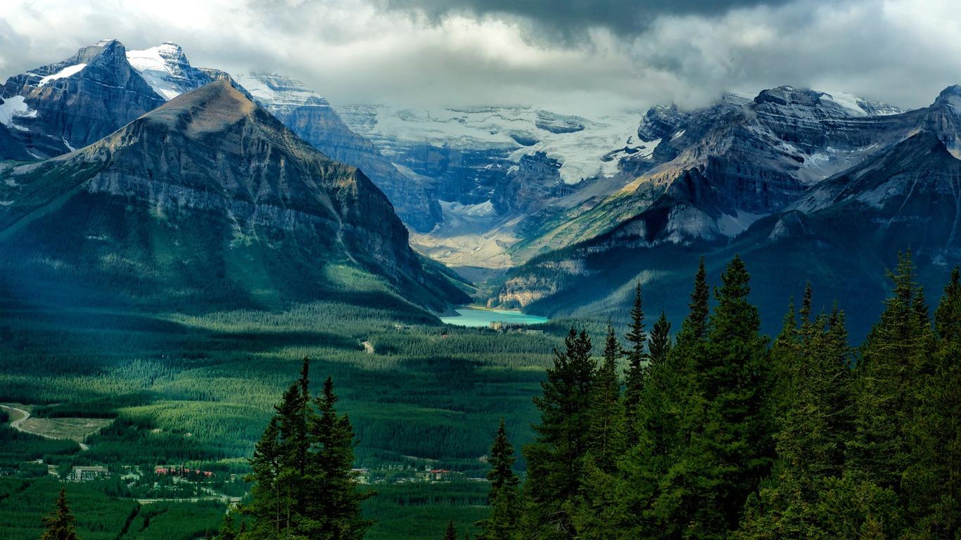 1366x768 Snow Capped Mountains In The Jungle IMac System Scenery HD Wallpaper