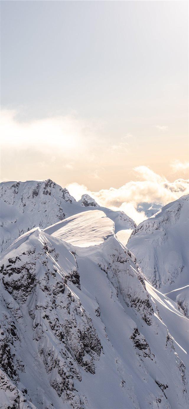 640x1385 Mountains covered by snow at daytime iPhone 11 wallpaper