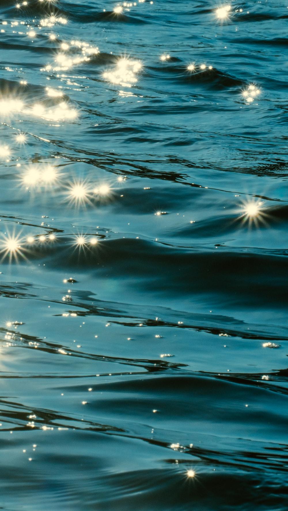 1000x1775 blue and white water during daytime photo