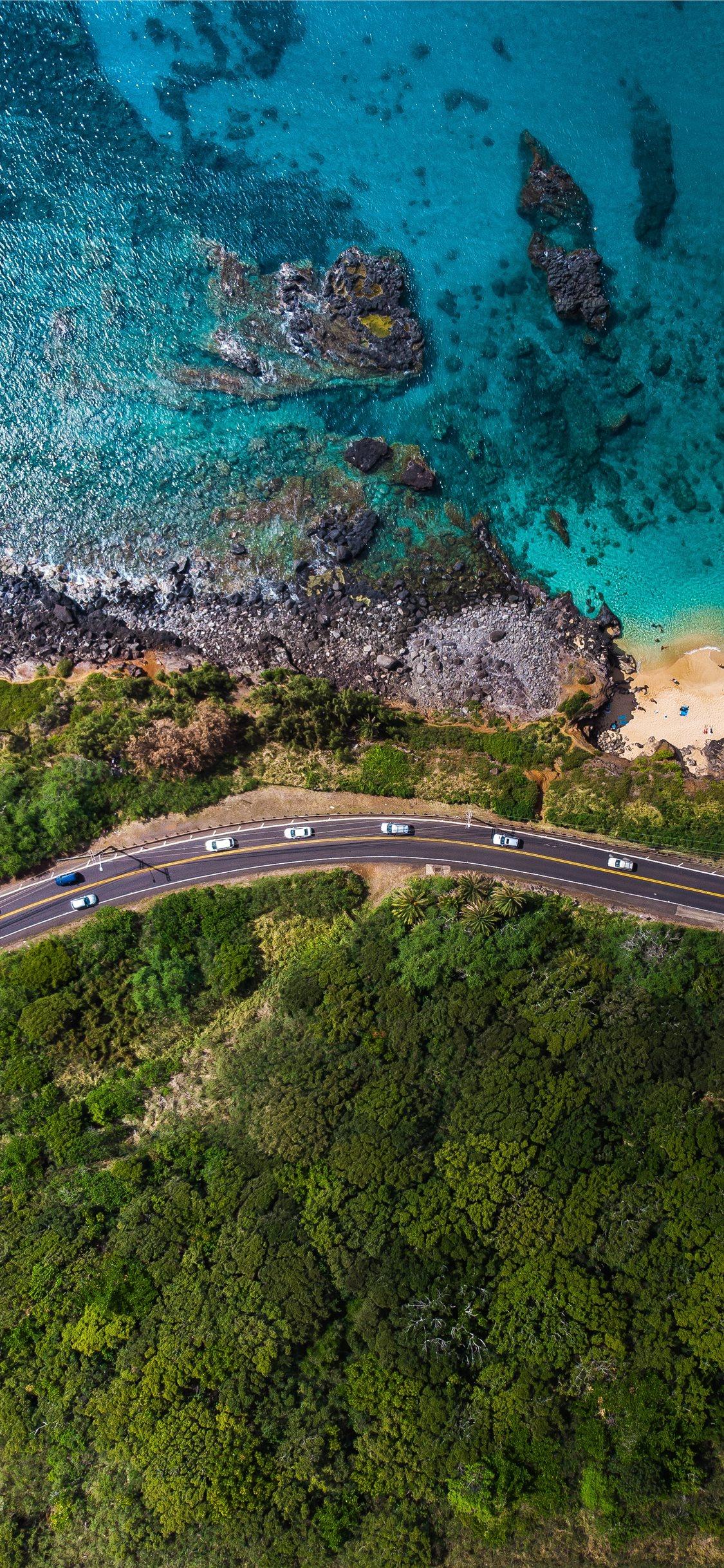 1125x2436 aerial view of road near body of water during dayt. iPhone 11 Wallpaper Free Download