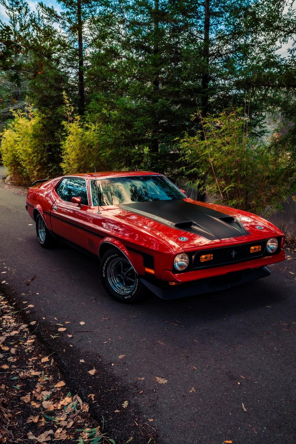1000x1499 red chevrolet camaro on road during daytime photo