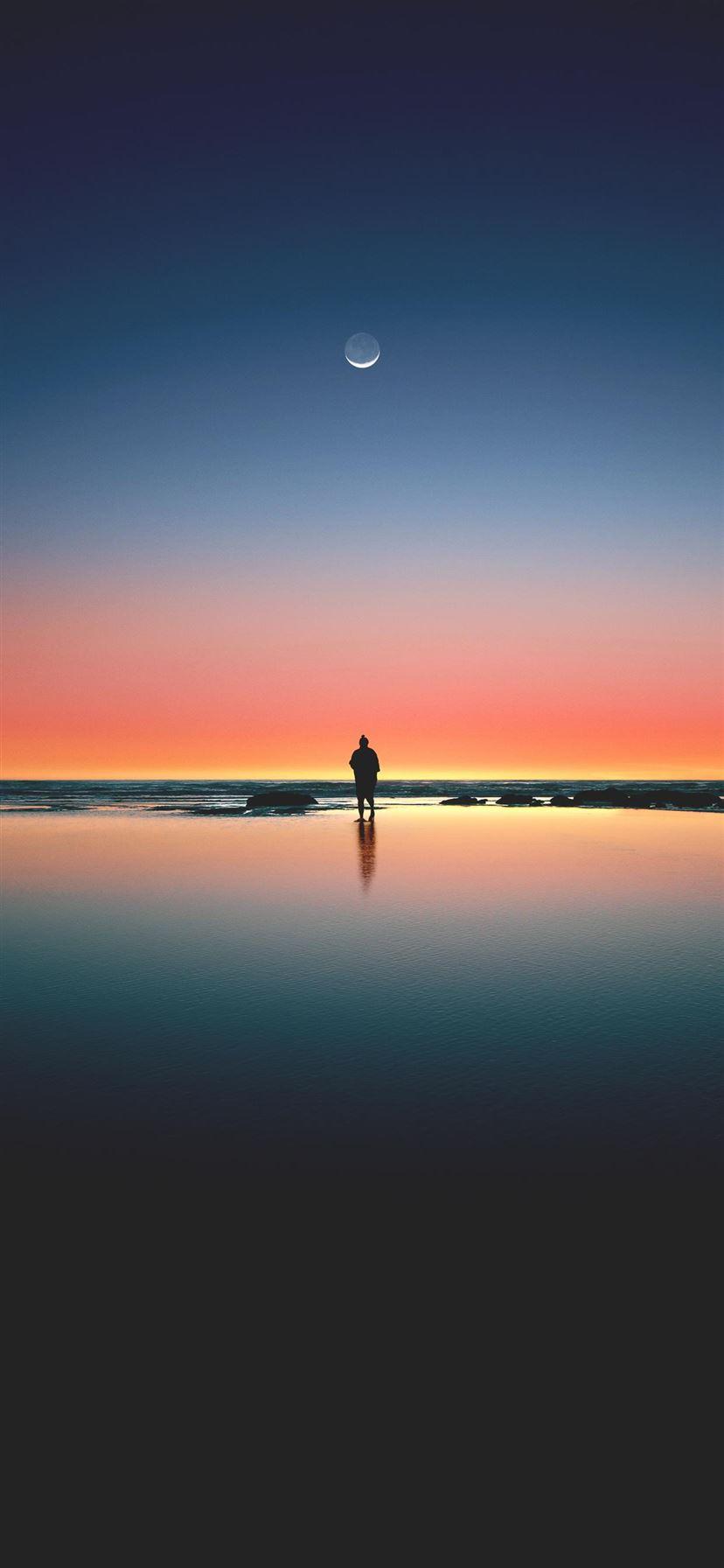 828x1792 silhouette of man standing on seashore iPhone 11 Wallpaper Free Download
