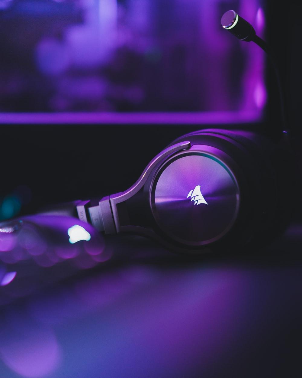 1000x1250 purple and black headphones on purple surface photo