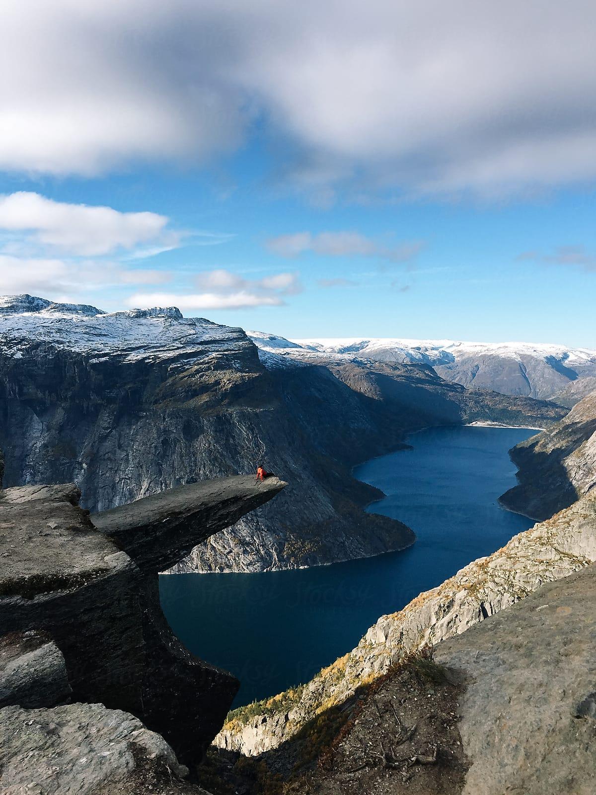 1200x1599 Hiker Sitting To The Edge Of Trolltunga Rock, Norway By Sky Blue Creative