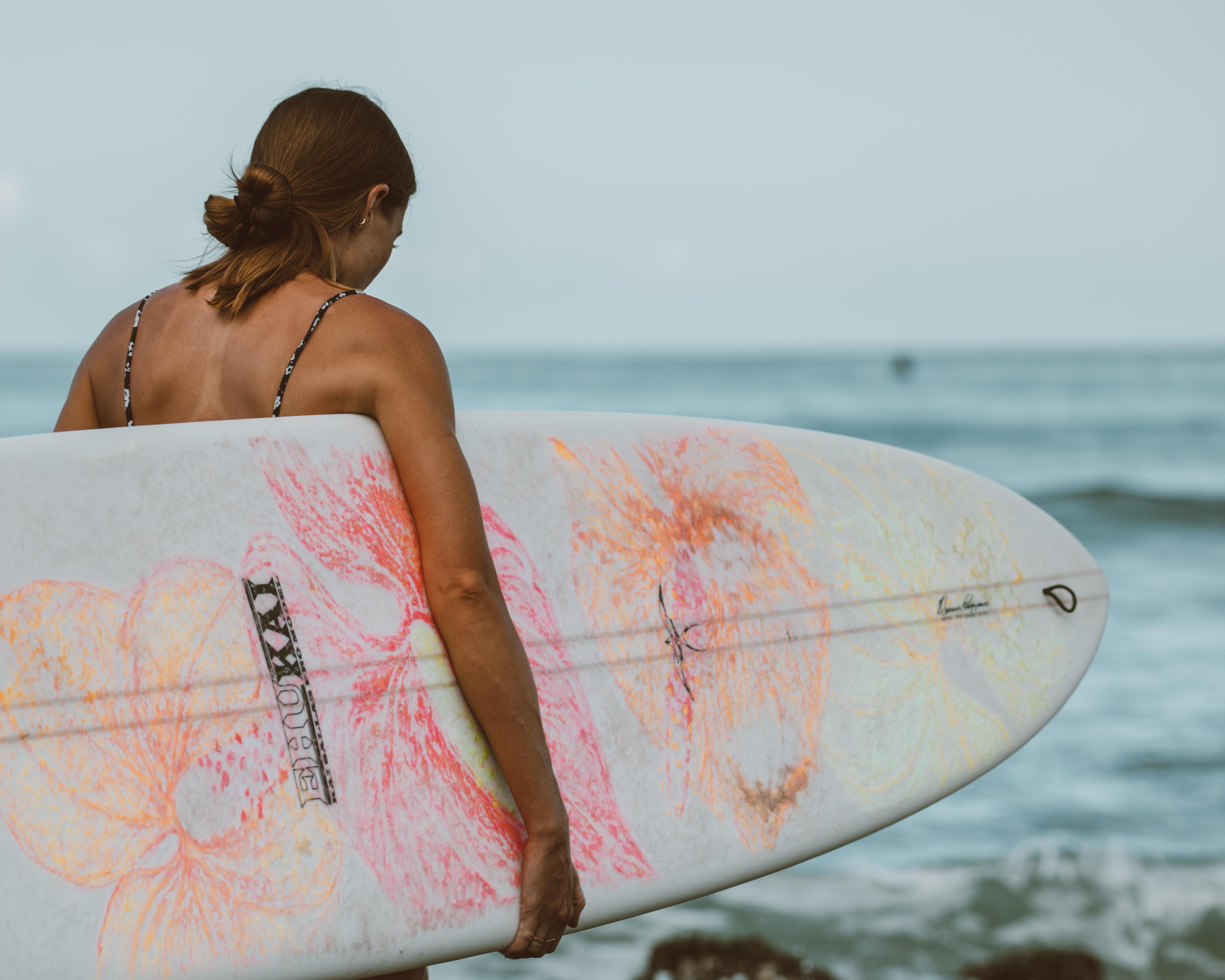 4500x3600 Woman in Pink and White Surfboard on Sea · Free