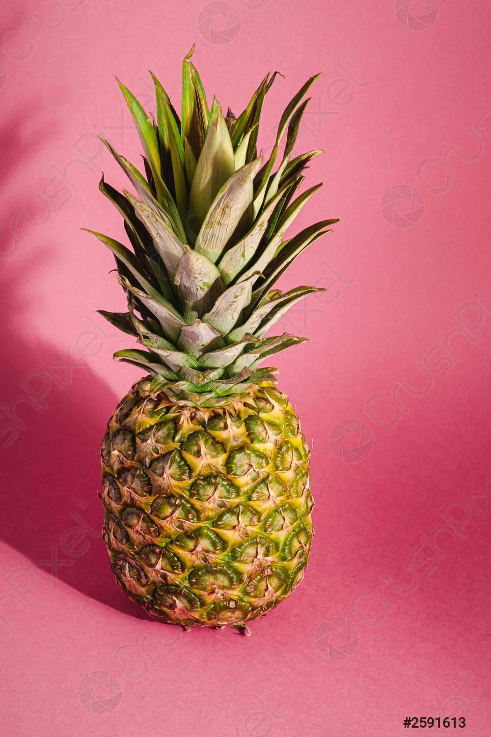 1000x1500 Fresh sweet pineapple on pink red background with hard shadow
