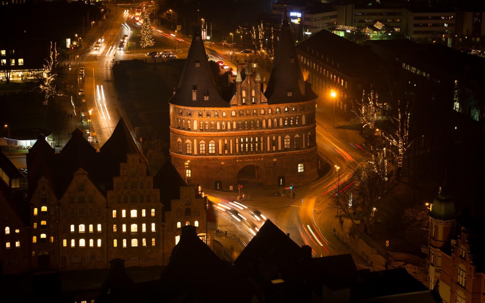 1920x1200 city, Cityscape, Architecture, Street, Night, Lights, Street Light, Old Building, Tower, Lübeck, Germany, Light Trails, Church, Long Exposure, Birds Eye View, Rooftops, Car, Traffic, Trees Wallpaper HD / Desktop and Mobile Background