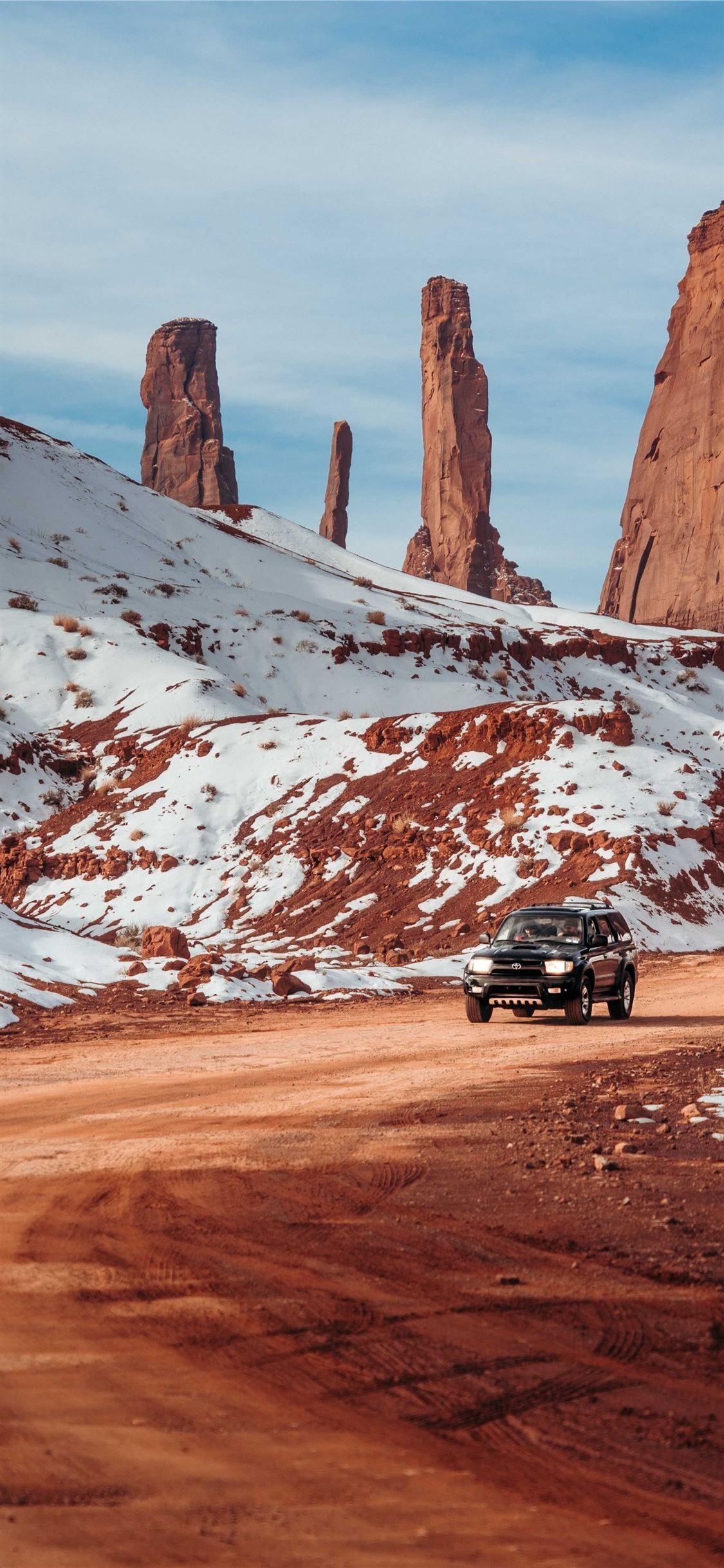 1125x2436 car travelling on desert #nature #mountain #Car #grey #iPhoneXWallpaper. Wallpaper iphone love, Live wallpaper iphone, Phone screen wallpaper