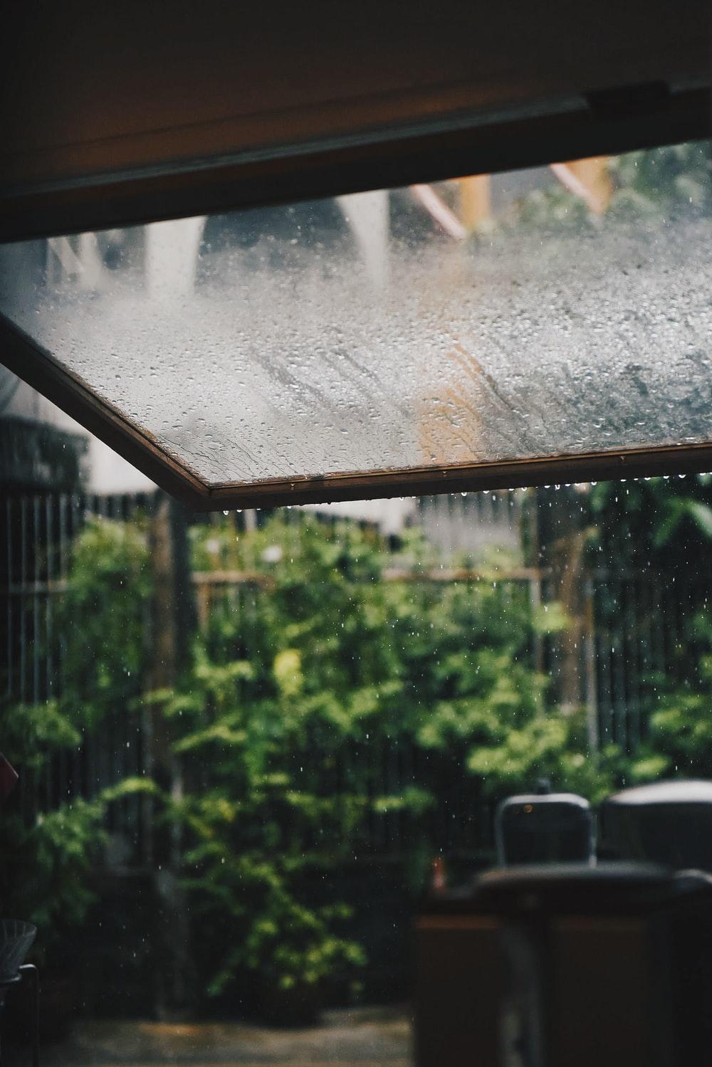 1000x1499 clear glass window with tear drop rain photo