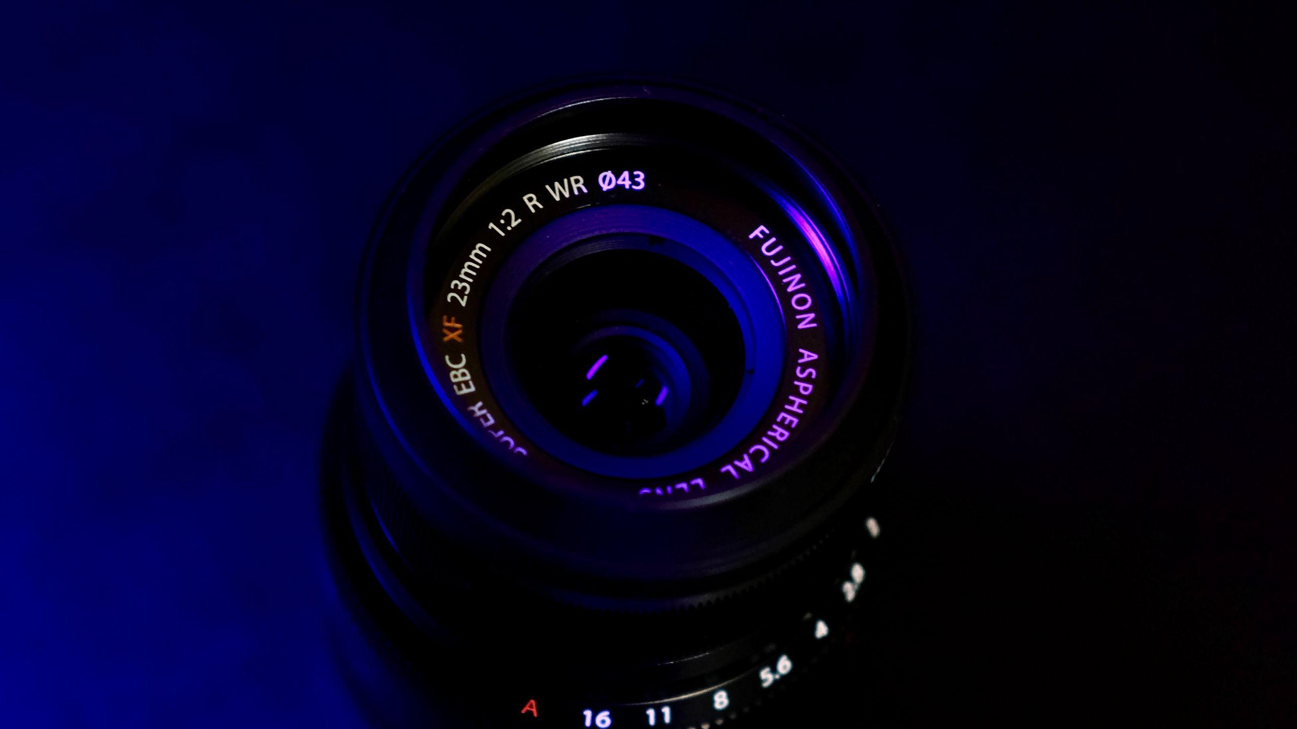 2560x1440 Download wallpaper 2560x1440 lens, dark, neon widescreen 16:9 HD background