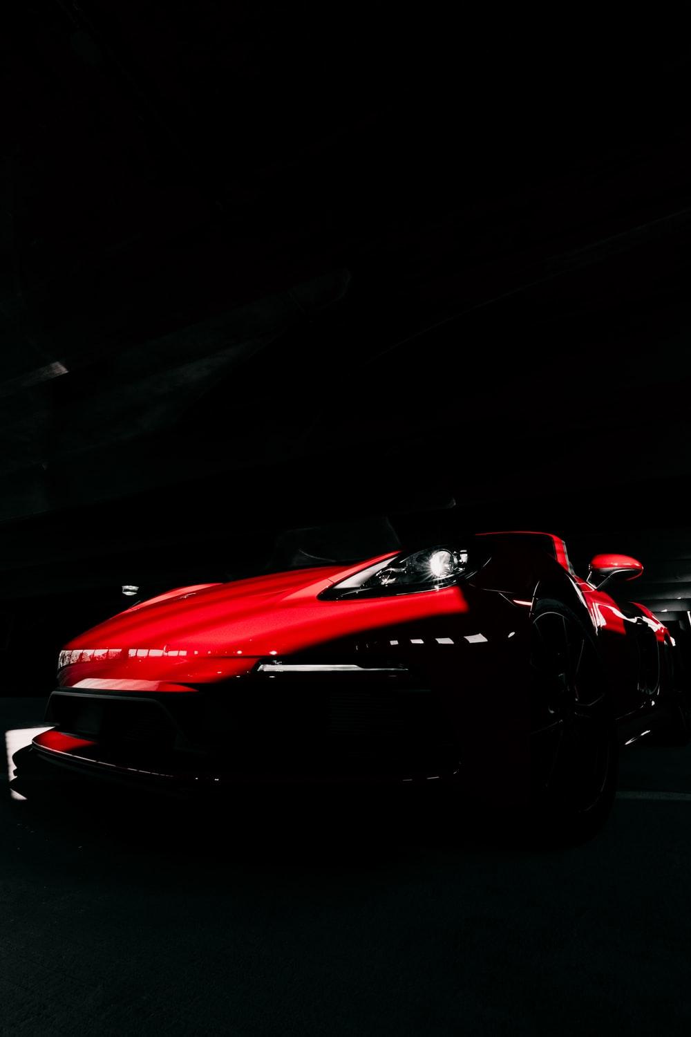 1000x1500 red ferrari 458 italia on black background photo