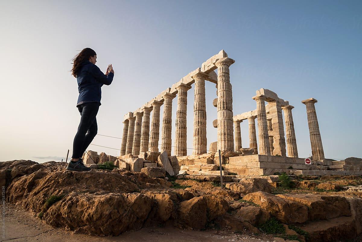 1200x801 Woman Taking Photo On The Temple Of Poseidon On Cape Sounion