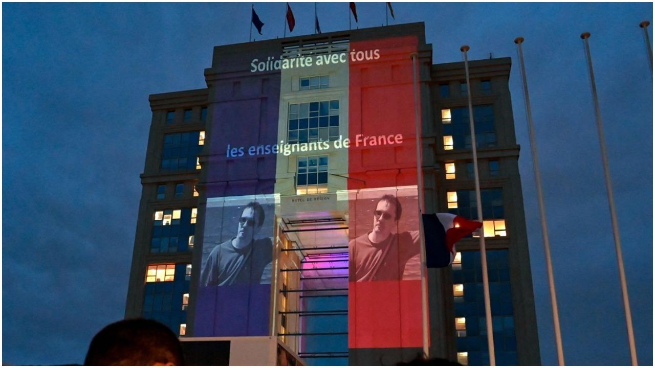 1280x720 France: Charlie Hebdo cartoons projected on government building to express solidarity with Samuel Paty
