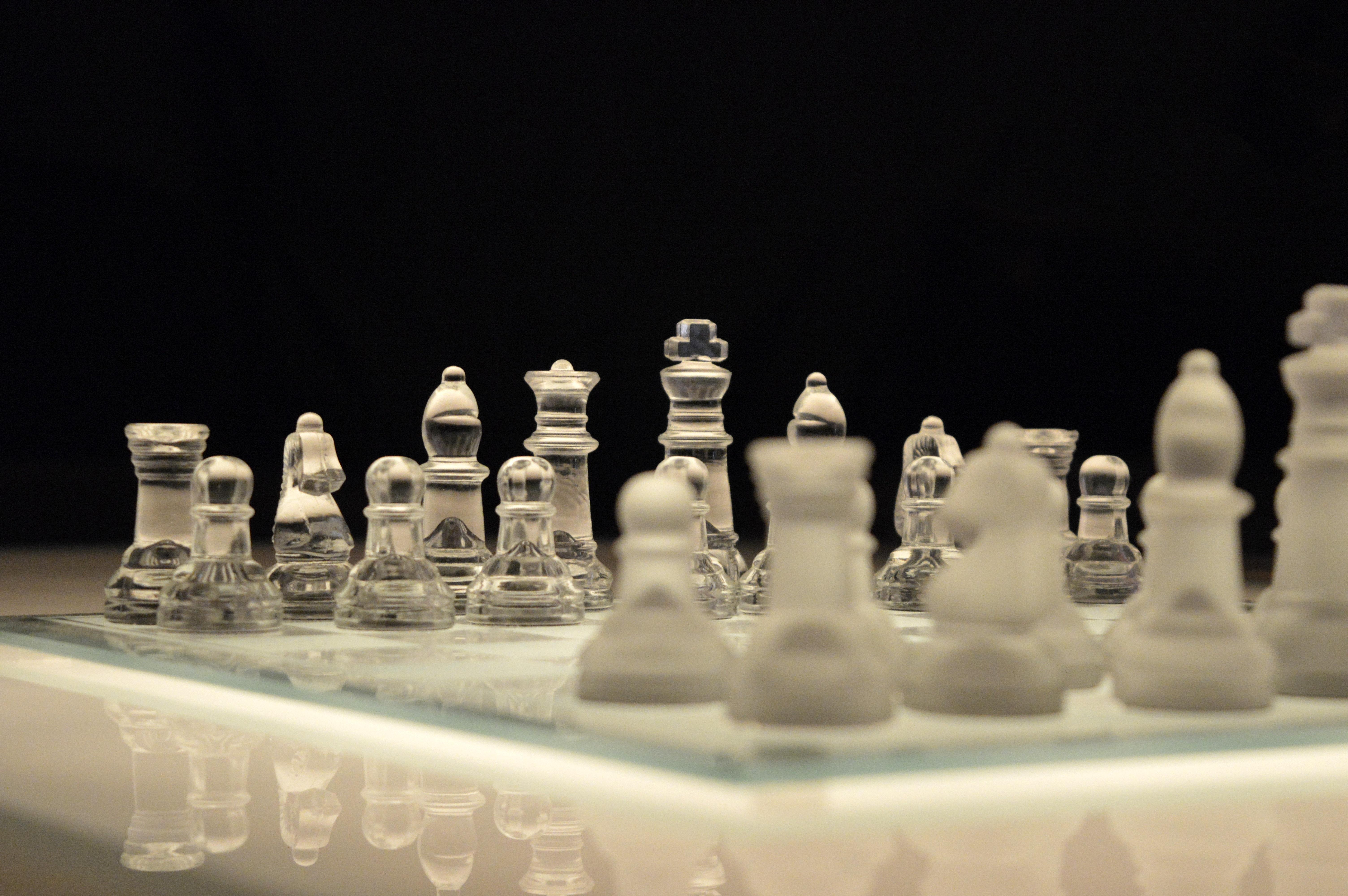 6016x4000 Clear Glass and White Chess Piece on White Chess Board With Black Background · Free