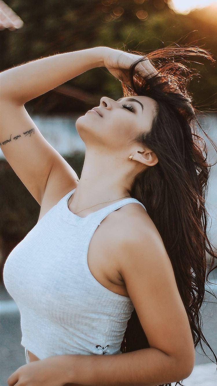750x1334 woman wearing white tank crop top iPhone 8 Wallpaper Free Download