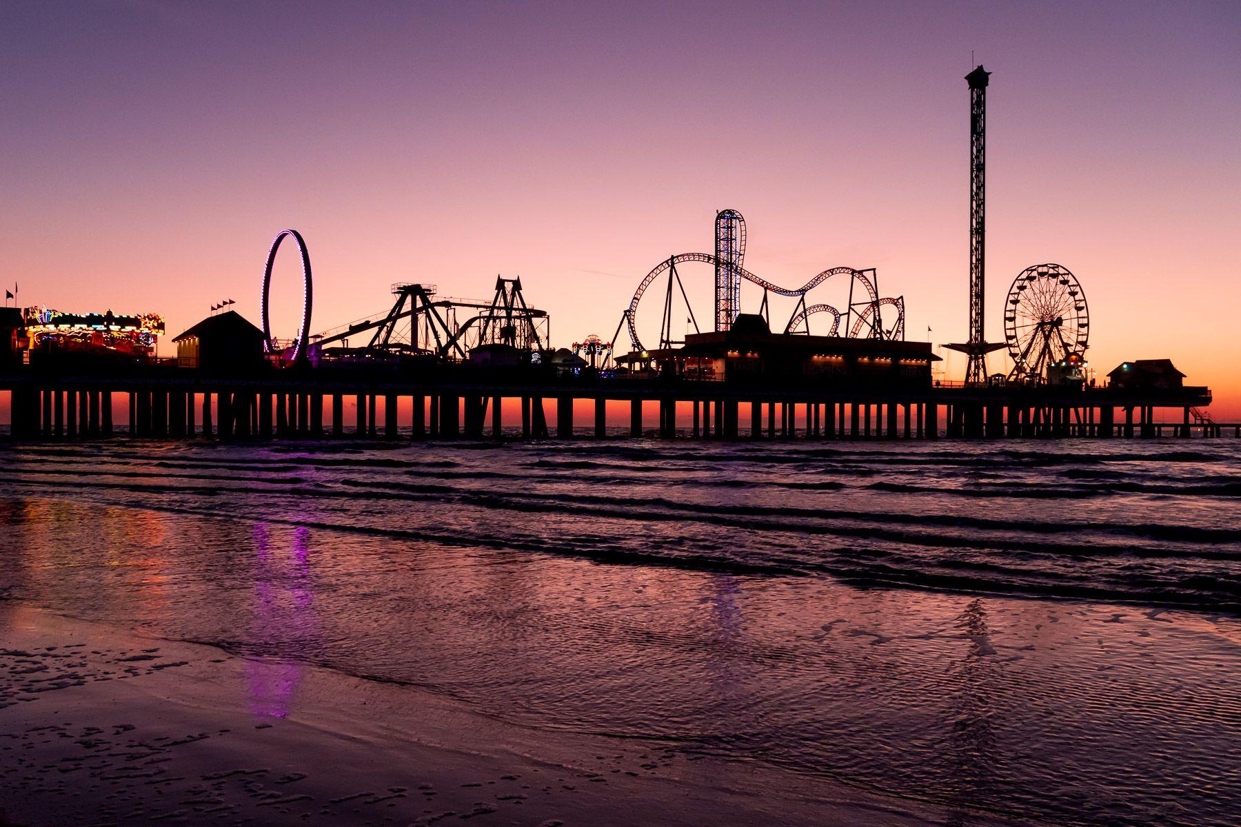 1800x1200 The morning sun silhouettes the Historic Pleasure Pier on the Galveston Texas beach. See more #photos at 7. Galveston beach, Galveston texas beach, Texas beaches
