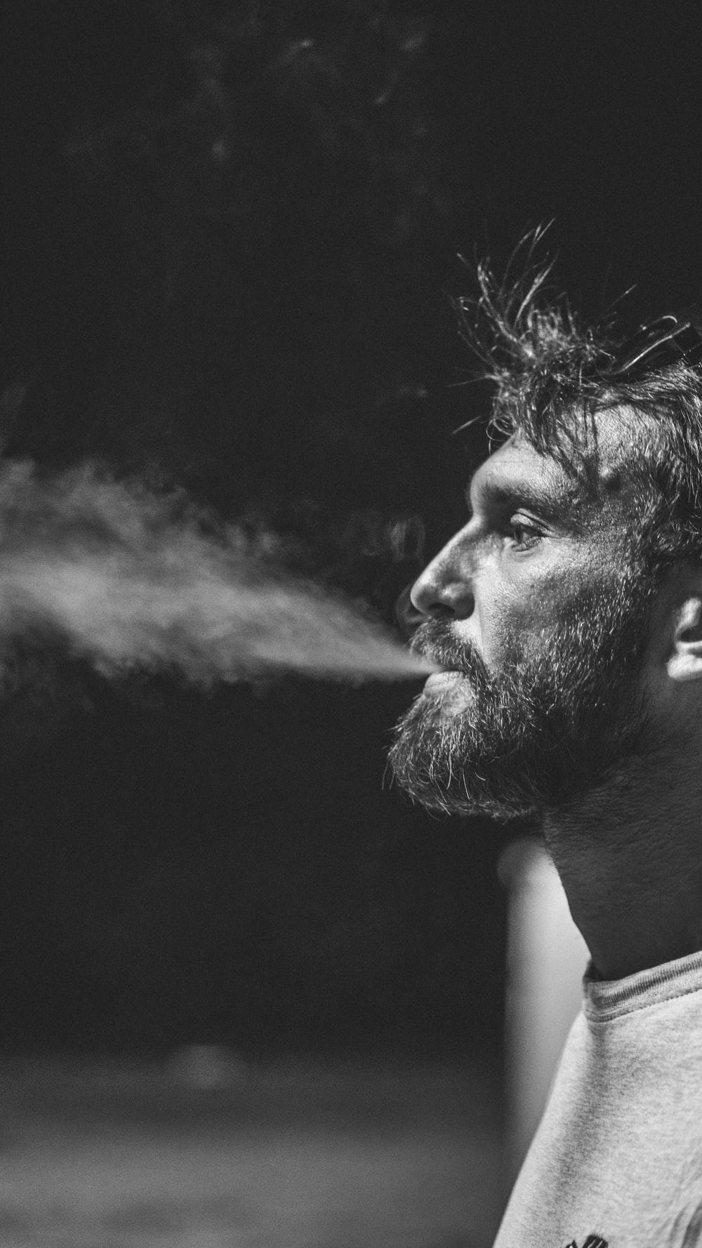 1000x1777 man smoking during daytime photo