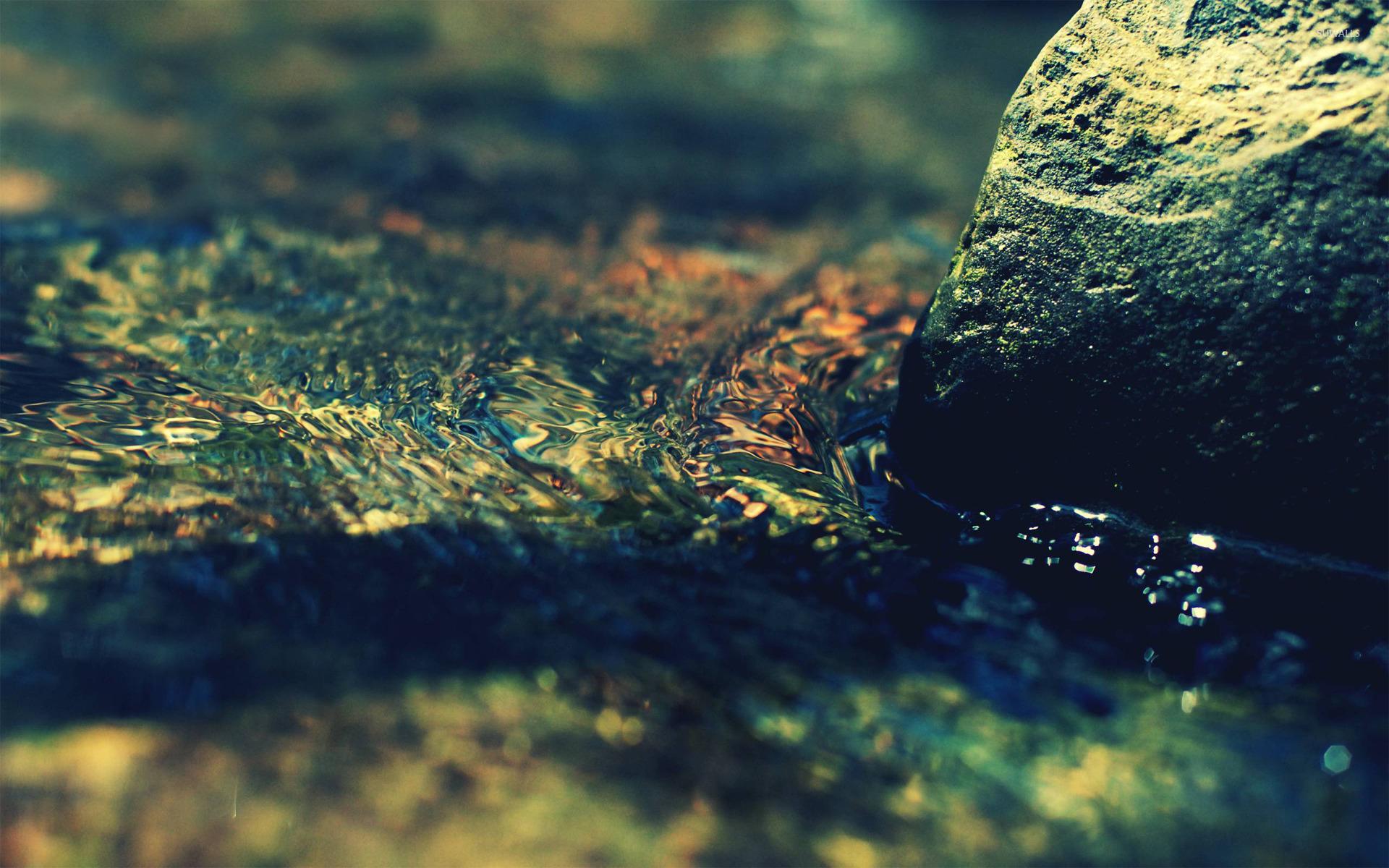 1920x1200 Water flowing around a rock wallpaper wallpaper