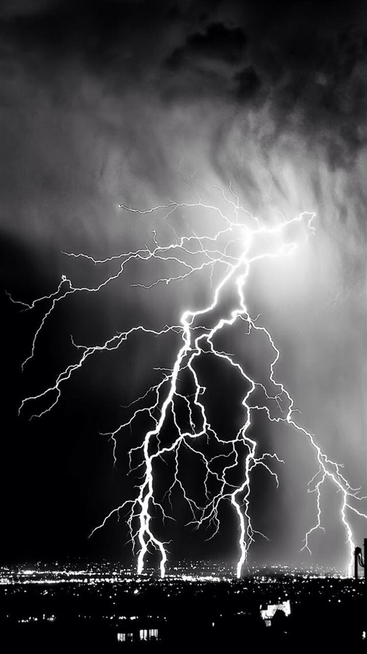 750x1334 Storm Lightening Over City iPhone 8 Wallpaper Free Download