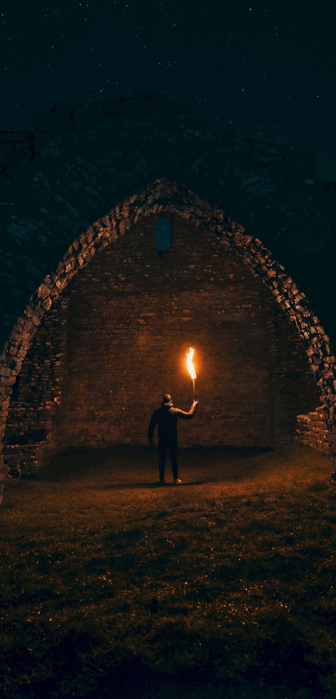 1080x2248 Download 1080x2248 Ancient Building, Torch, Light, Flames, Back View, Man Wallpaper for Xiaomi Mi 8 Pro