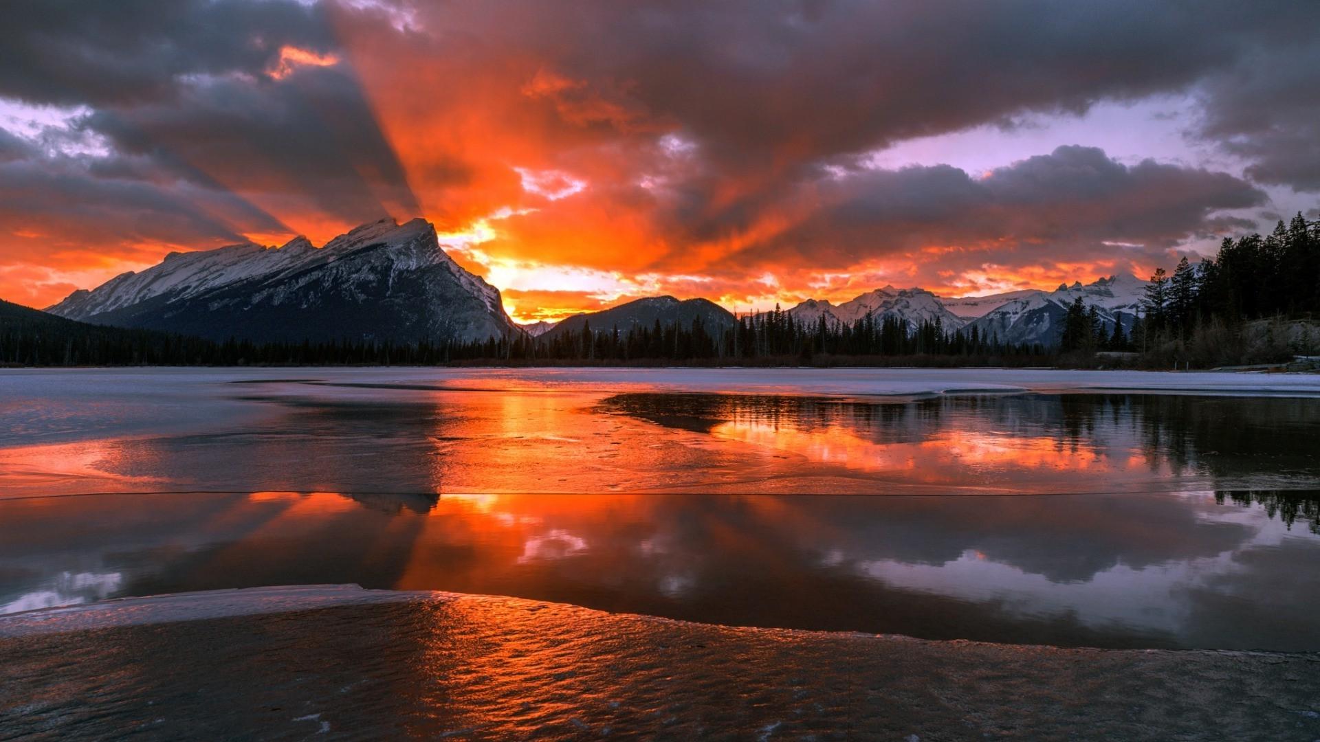 1920x1080 1920x1080 nature landscape mountain canada alberta snow winter trees forest water lake sun clouds pine trees frozen lake ice sunset snowy peak reflection wallpaper JPG 402 kB