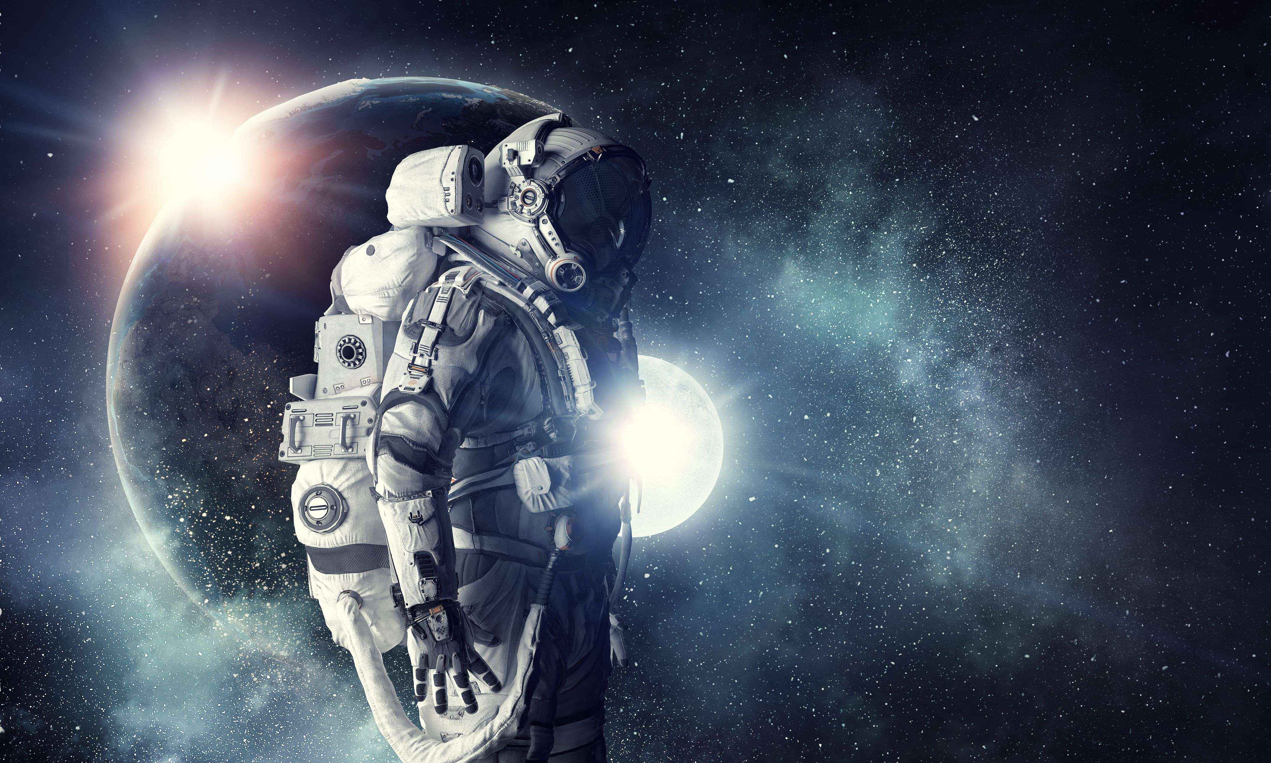 4300x2580 Astronaut in outer space. Mixed media. Mixed media
