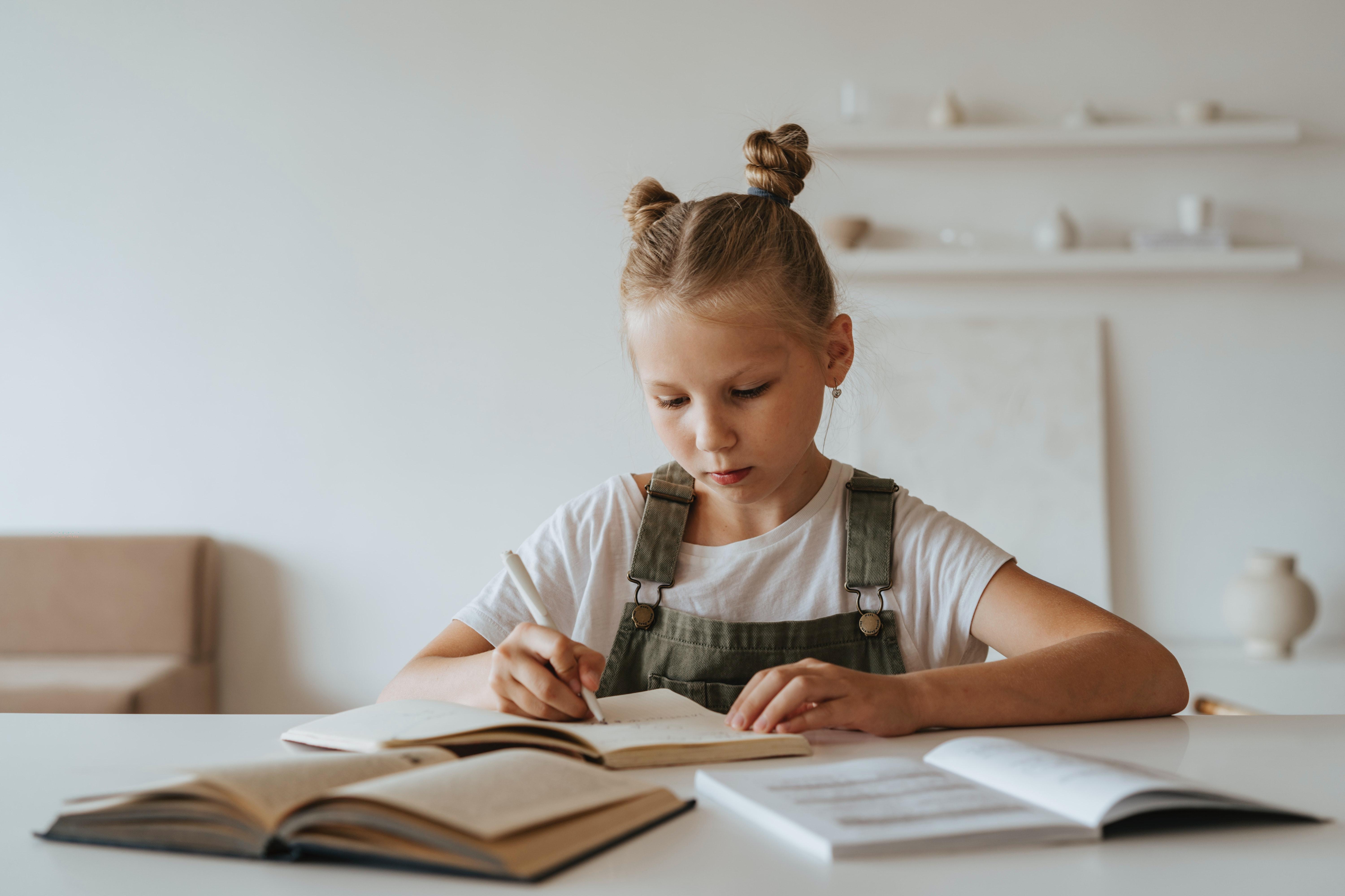 6000x4000 Little Girl Doing her Homework · Free